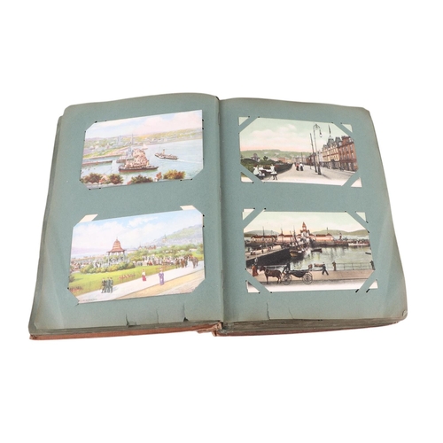 716 - A collection of postcard albums, mostly complete, with topographical and comical examples; together ... 