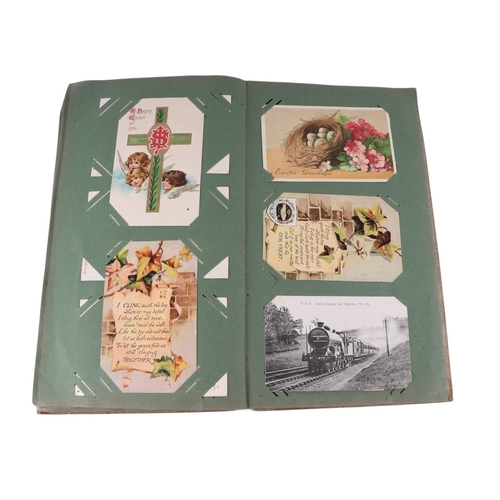 722 - An Edwardian postcard album containing topographical and comical cards; together with some loose pos... 