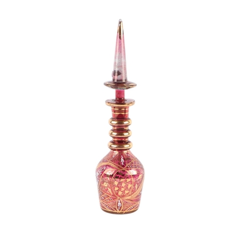 735 - A Bohemian ruby glass decanter and stopper with gilt and enamelled decoration for the Turkish market... 