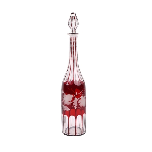 739 - A Bohemian ruby flashed glass decanter and stopper with grape and vine engraved decoration, 39cms hi... 