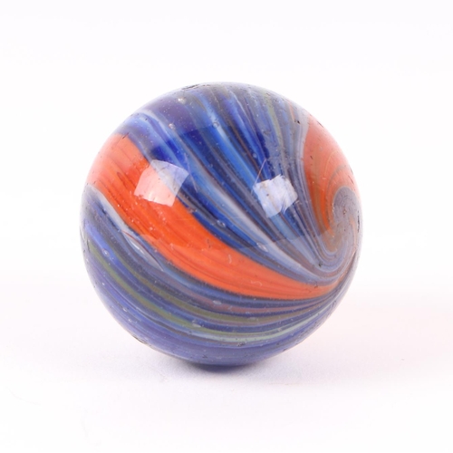 745 - A large Victorian onion skin glass marble, predominantly blue / red, approx 4cms diameter.