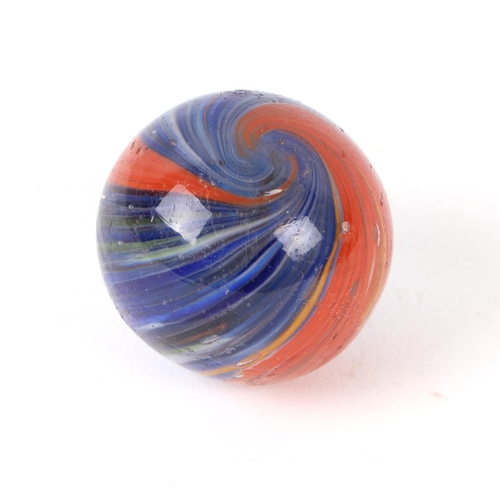 745 - A large Victorian onion skin glass marble, predominantly blue / red, approx 4cms diameter.