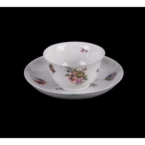 752 - An English 18th century tea bowl and saucer decorated with insects and flowers with central armorial... 