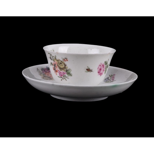 752 - An English 18th century tea bowl and saucer decorated with insects and flowers with central armorial... 