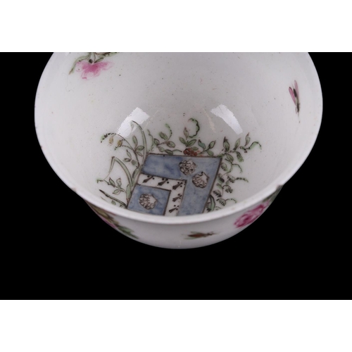 752 - An English 18th century tea bowl and saucer decorated with insects and flowers with central armorial... 