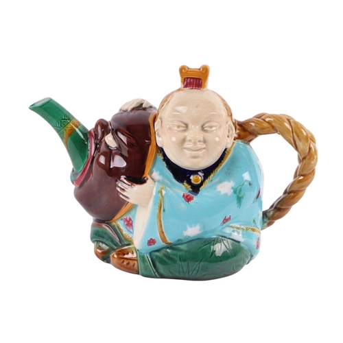 764 - A late Victorian (circa 1870) Minton majolica Chinaman teapot and cover, 19cms wide.