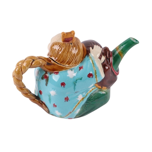 764 - A late Victorian (circa 1870) Minton majolica Chinaman teapot and cover, 19cms wide.