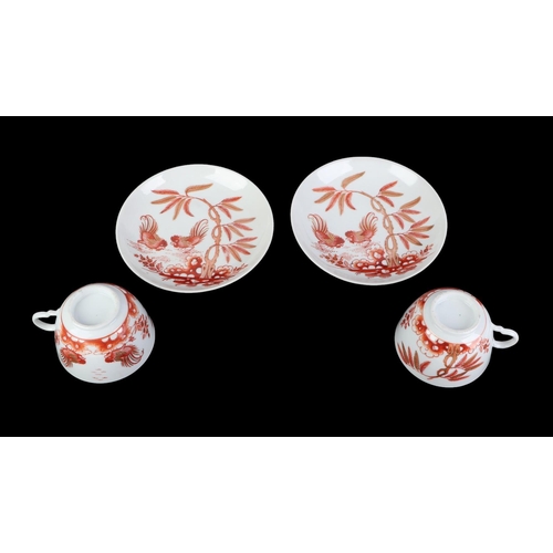 769 - A pair of 18th century Doccia porcelain tea cups and saucers decorated in Rust Roosters pattern.