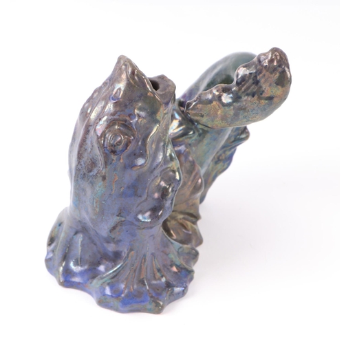 780 - A Studio pottery blue lustre glazed vase in the form of a fish, 18cms high.