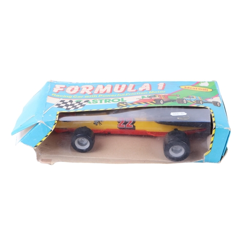 786 - A 1970's German tinplate Formula 1 racing car with power friction motor, 25cms long, boxed.