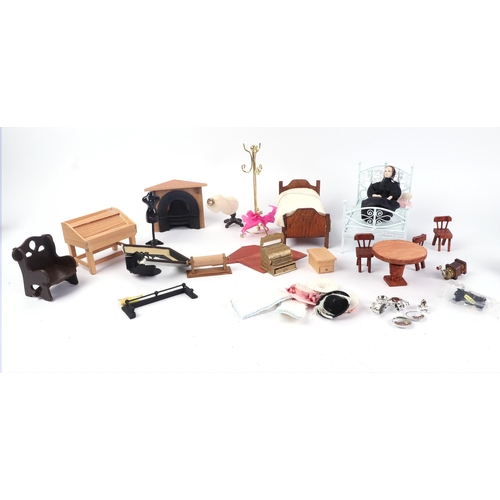 79 - A large quantity of doll's house furniture, mostly 20th century.