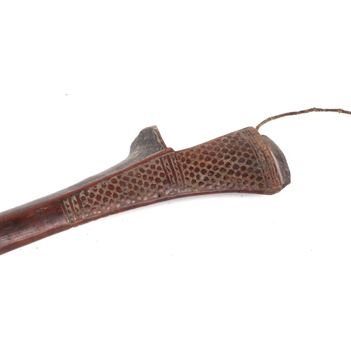 804 - A Fijian / Fiji Island hardwood club with chip carved decoration, 68cms long.