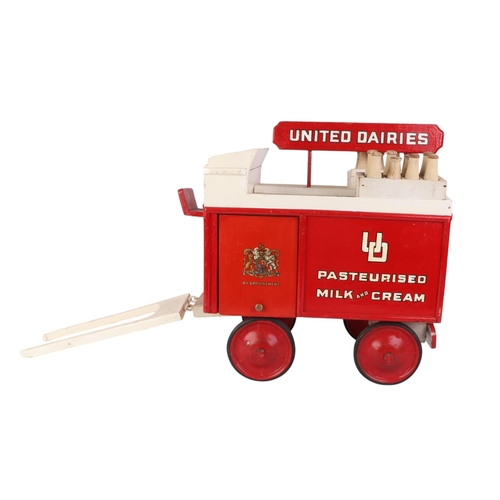 81 - A scratch built painted wooden United Dairies milk cart, 41cms long.