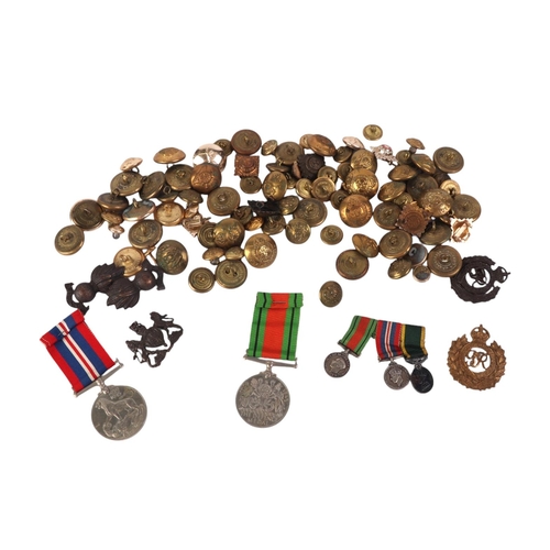 817 - A large collection of military items to include cap badges, shell cases and other items.