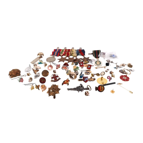 817 - A large collection of military items to include cap badges, shell cases and other items.