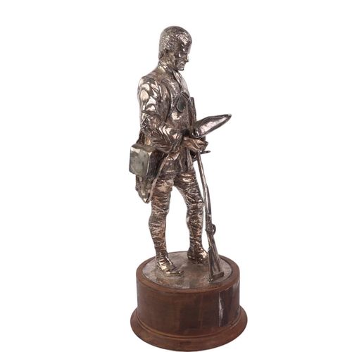 819 - American War of Independence interest:  A silver plated figural group depicting a Frontier Soldier h... 