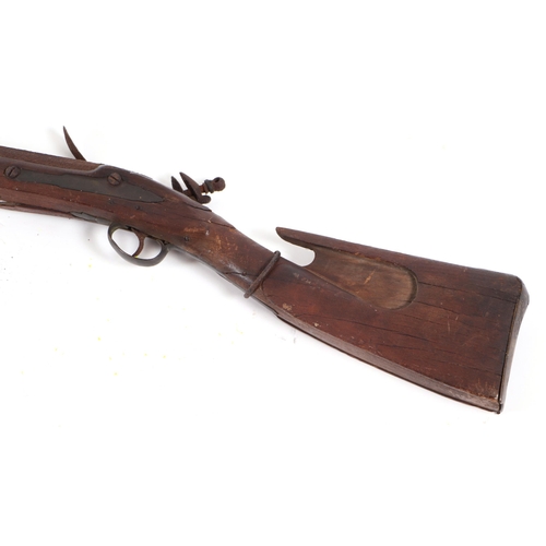 825 - An 18th century British flintlock musket with unusual shaped stock, 170cms overall length.Condition ... 