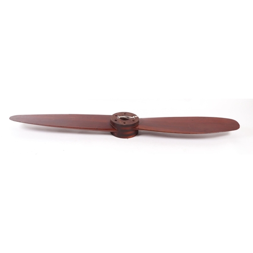 843 - A large mahogany propeller, 173cms long.