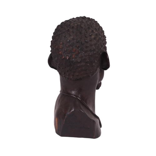 86 - Israel Chikumbirike (Zimbabwe school b1954) - a large carved ebony bust of an African man wearing a ... 