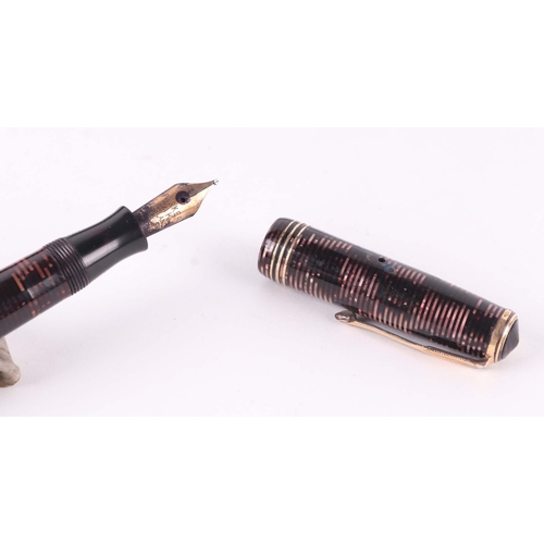 945 - A Parker Duofold fountain pen with 14K gold nib; together with four other fountain pens (5)