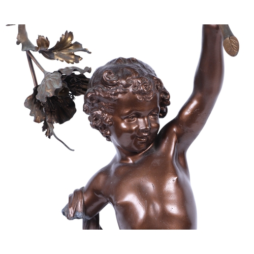 687 - After Auguste Moreau, a very large spelter bronzed lamp in the form of a cherub with a floral garlan... 