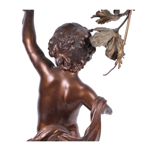 687 - After Auguste Moreau, a very large spelter bronzed lamp in the form of a cherub with a floral garlan... 