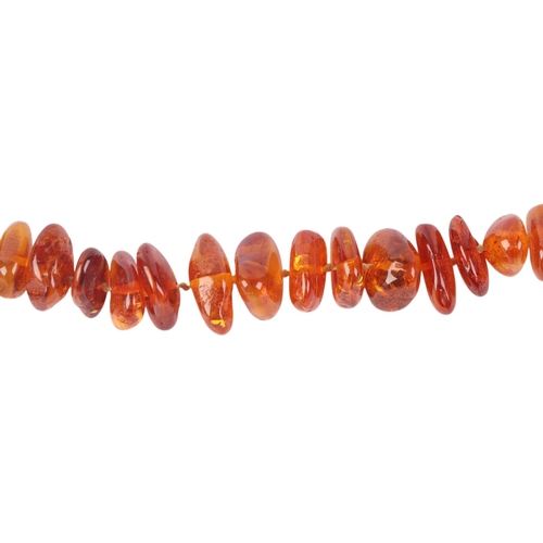 544 - A faceted amber bead necklace, approx 22g; together with an amber pebble bead necklace, 29g (2).