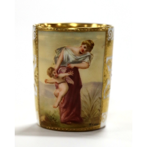 63 - A Vienna porcelain cabinet coffee cup and saucer decorated with a picture panel depicting a young wo... 