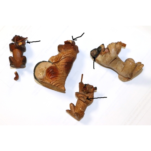 299 - A fifteen Black Forest / Anri style comical dog band, each carved as a different breed, each approx ... 