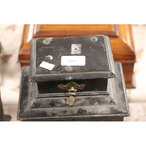 1697 - An 18th century continental ebonised table cabinet, the lift-up top above a pair of doors with a dra... 