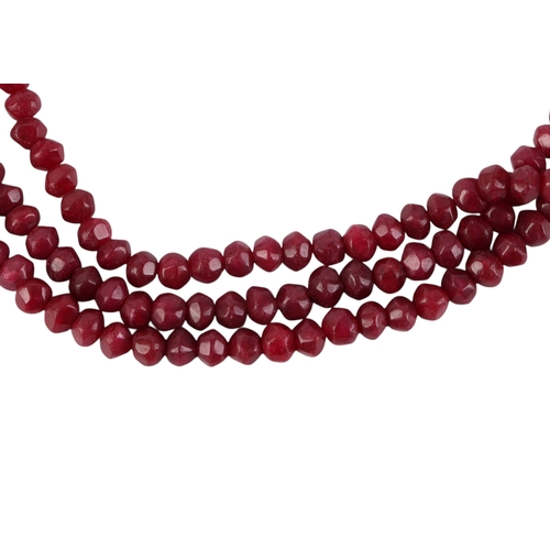 1937 - An Indian three-strand rough faceted cut ruby bead necklace.