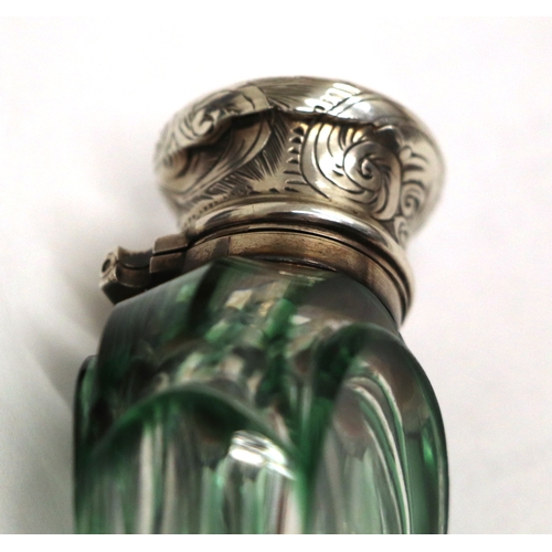 1109 - A Victorian unmarked silver ribbed glass scent bottle with internal blue, yellow and gilt cranberry ... 