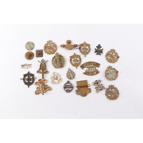 103 - A quantity of military cap badges and similar items including Monkton Coombe, Ridley College and OTC... 