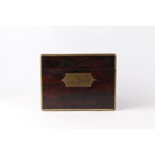 261 - A Victorian brass bound rosewood toilet box with fitted interior containing silver mounted jars and ... 