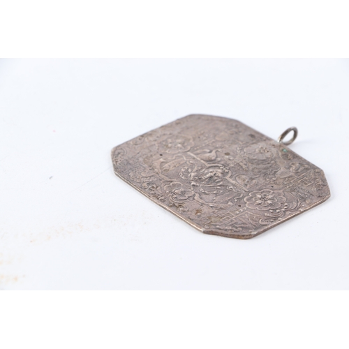 551 - A white metal (tests as silver) panel pendant plaque with ornate classical decoration, 7 by 5.5cms, ... 