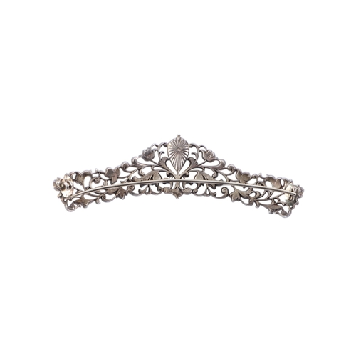 487 - A Victorian paste set brooch converted from a tiara, foil backed, 9.5cms wide; together with a silve... 