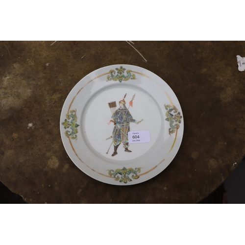 604 - A 19th century Chinese porcelain dish decorated with a depiction of an archer, 22cms diameter.