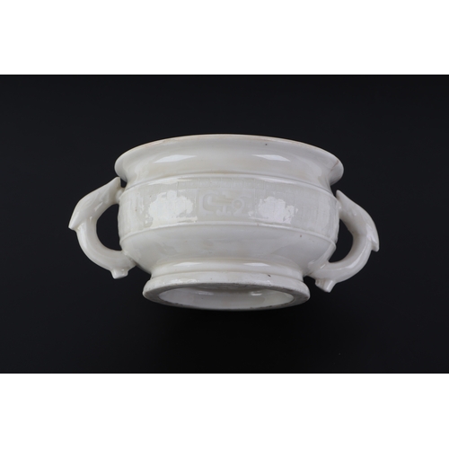 623 - A Chinese blanc de chine two-handled censer with archaic decoration, 11.5cms diameter.