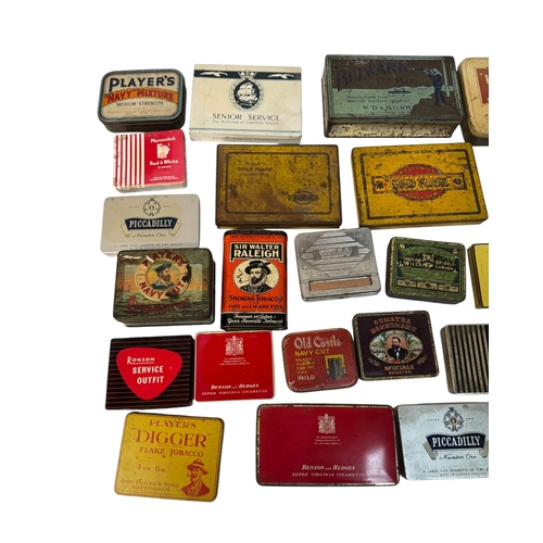 11 - A quantity of vintage advertising tins, mainly tobacco related.