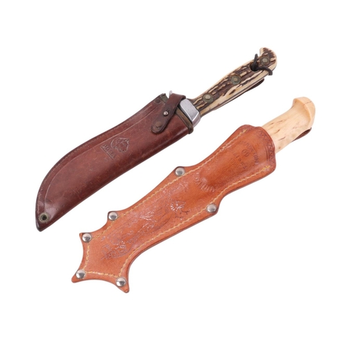 117 - A Puma sheath knife with antler handle and leather scabbard; together with another similar (2).