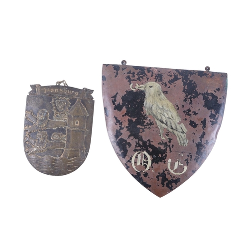 122 - A re-enactment decorative metal circular shield decorated with griffins, 58cms diameter; together wi... 