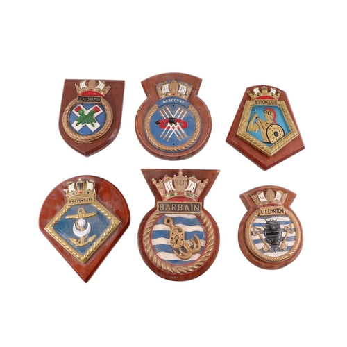 124 - A collection of Naval  insignia plaques mounted on wooden shields, including Portsmouth, Glaserton, ... 