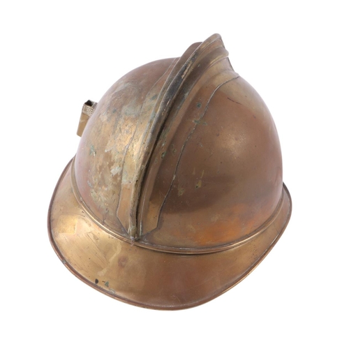 128 - A late 19th century French Fire Brigade brass helmet with crest badge for Sapeurs-Pompiers de Lesseu... 