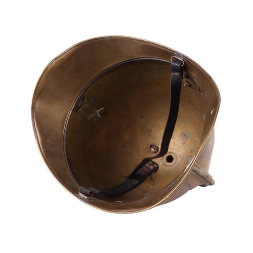 128 - A late 19th century French Fire Brigade brass helmet with crest badge for Sapeurs-Pompiers de Lesseu... 