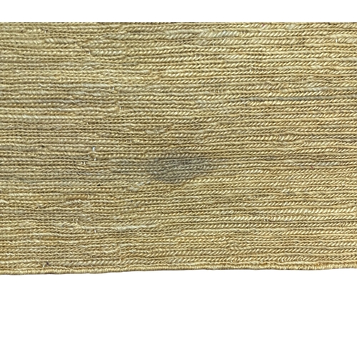 129 - A large hessian floor rug. 242 by 433cms.