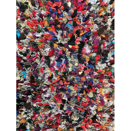 131 - An early 20th century rag rug, approx 130 by 95cms.