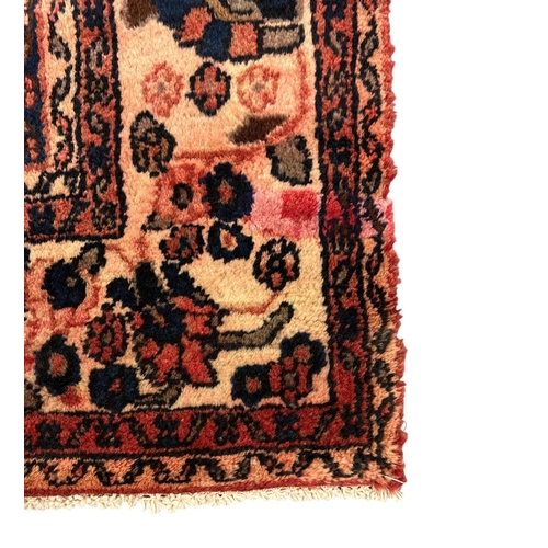 154 - A Persian Tabriz carpet with central floral medallion and floral corners within borders, on a beige ... 