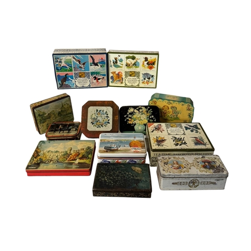 18 - A quantity of vintage advertising tins, mainly biscuit tins.