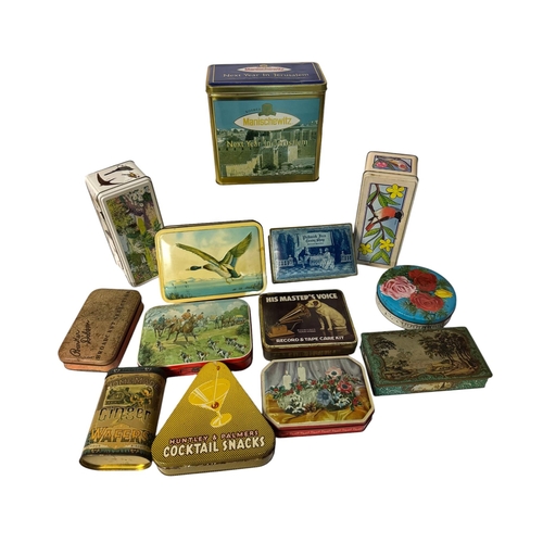 18 - A quantity of vintage advertising tins, mainly biscuit tins.