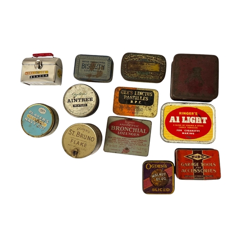 22 - A quantity of vintage advertising tins.